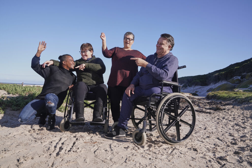Disabled Friends Relaxing In Landscape